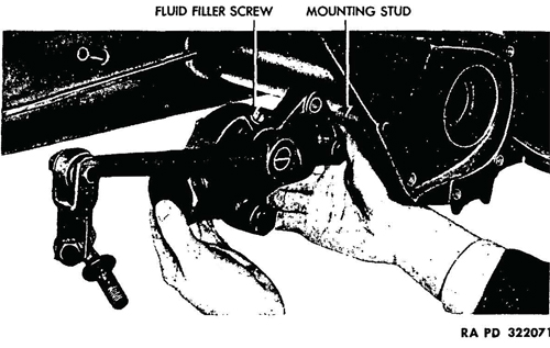 Figure 62—Removing Rear Shock Absorber